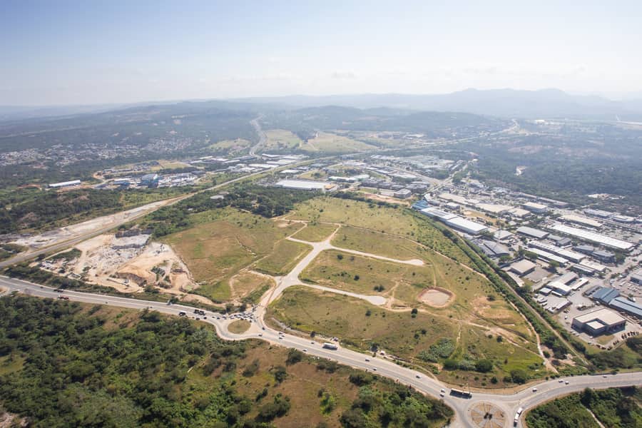 Aerial view of a serviced development site, roads laid out across open land